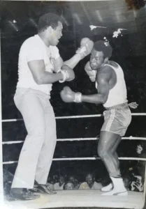 Two men fighting in a boxing ring